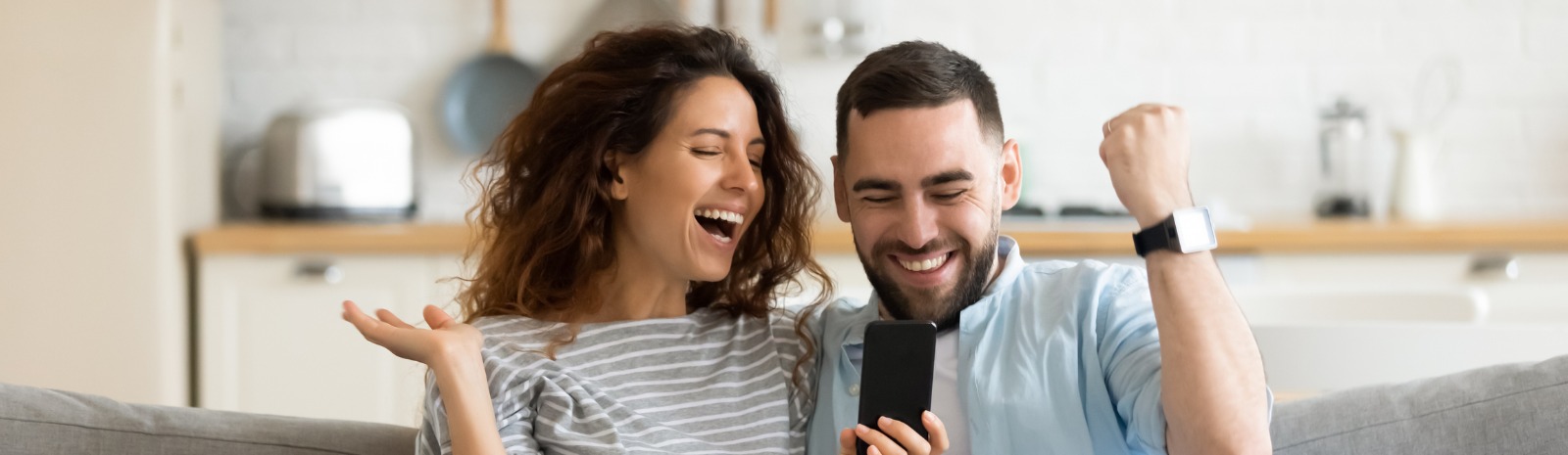 Happy couple with cell phone