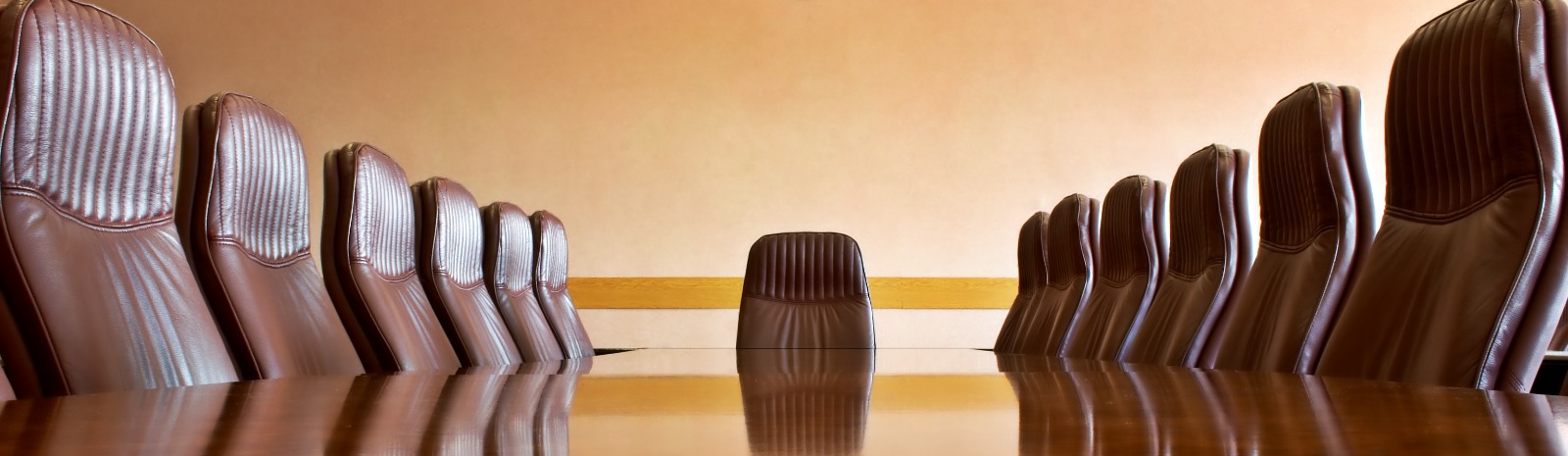 Board room table and empty chairs